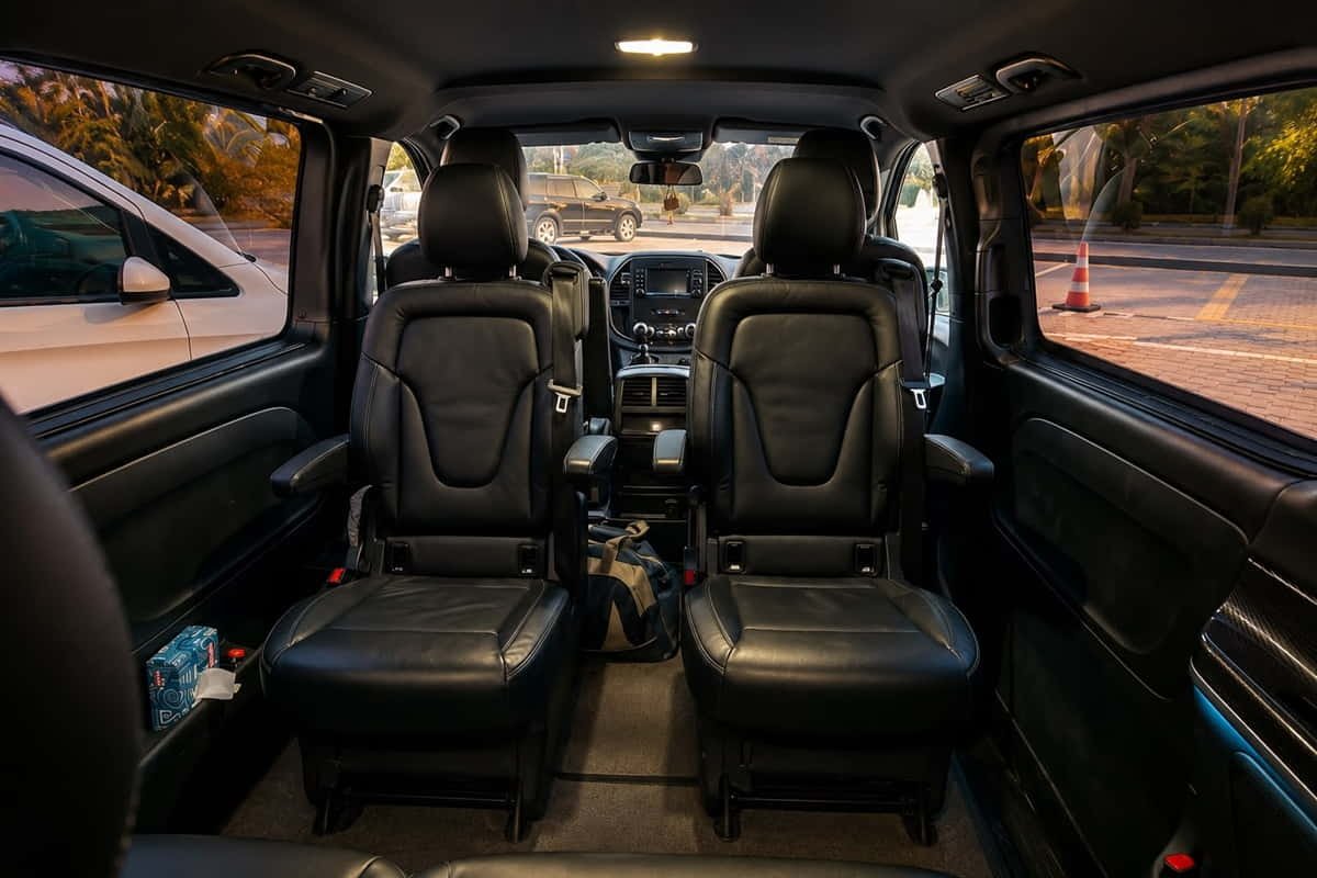 Front interior of 6-seater minivan in Baku with driver area