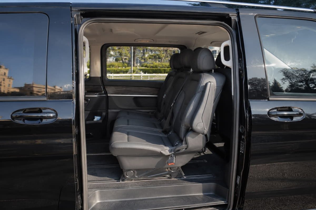 Rear seats of 7-seater minivan with comfortable leather interior in Baku
